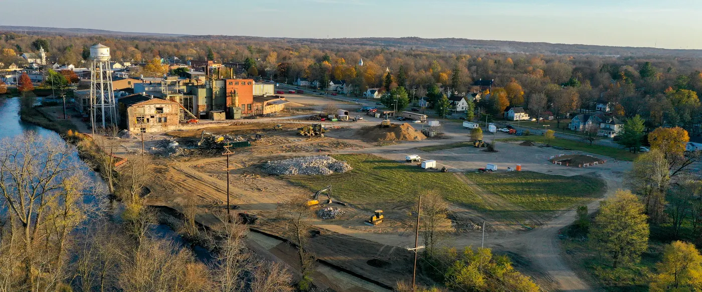 Fall drone view over the paper mill redevelopment site, the water tower and the Kalamazoo River