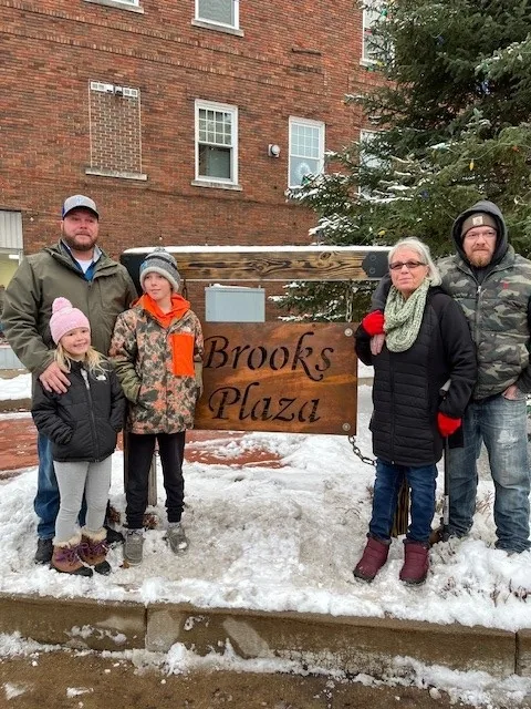 The Brooks Plaza sign, 2024