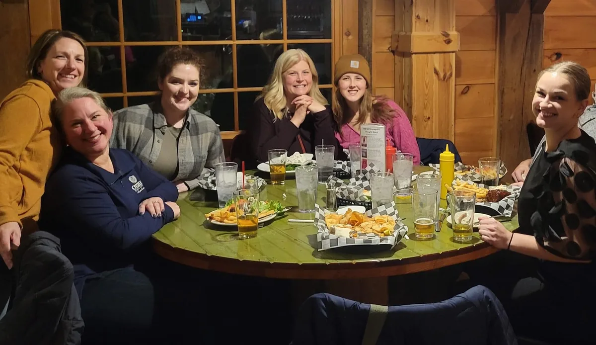 A group having dinner at the Old Mill during Ladies Night